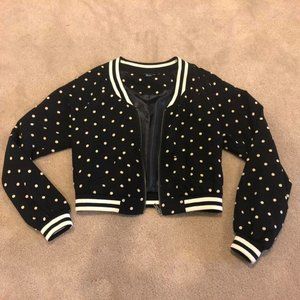 Black and cream polka dotted varsity style cropped jacket